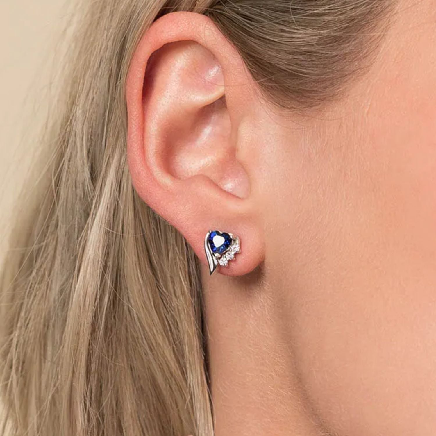 Close-Up of Rhodium-Plated Sterling Silver Blue Sapphire Heart Earrings