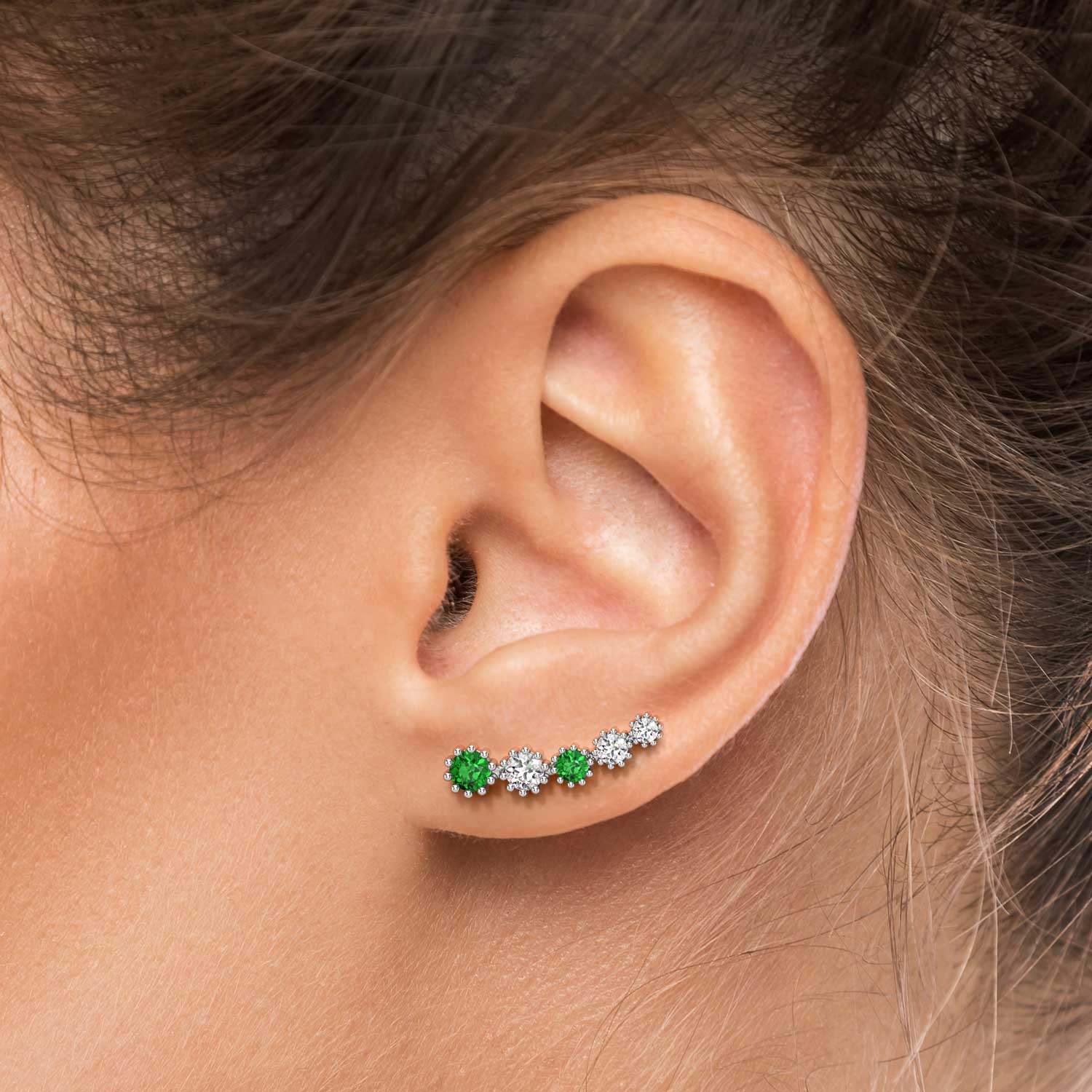 emerald climber earrings on model