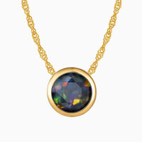 Bezel Set Black Round Opal Necklace in Gold by Irosk ® - Elegant fine jewelry featuring a round black opal pendant set in 18K real gold-plated silver