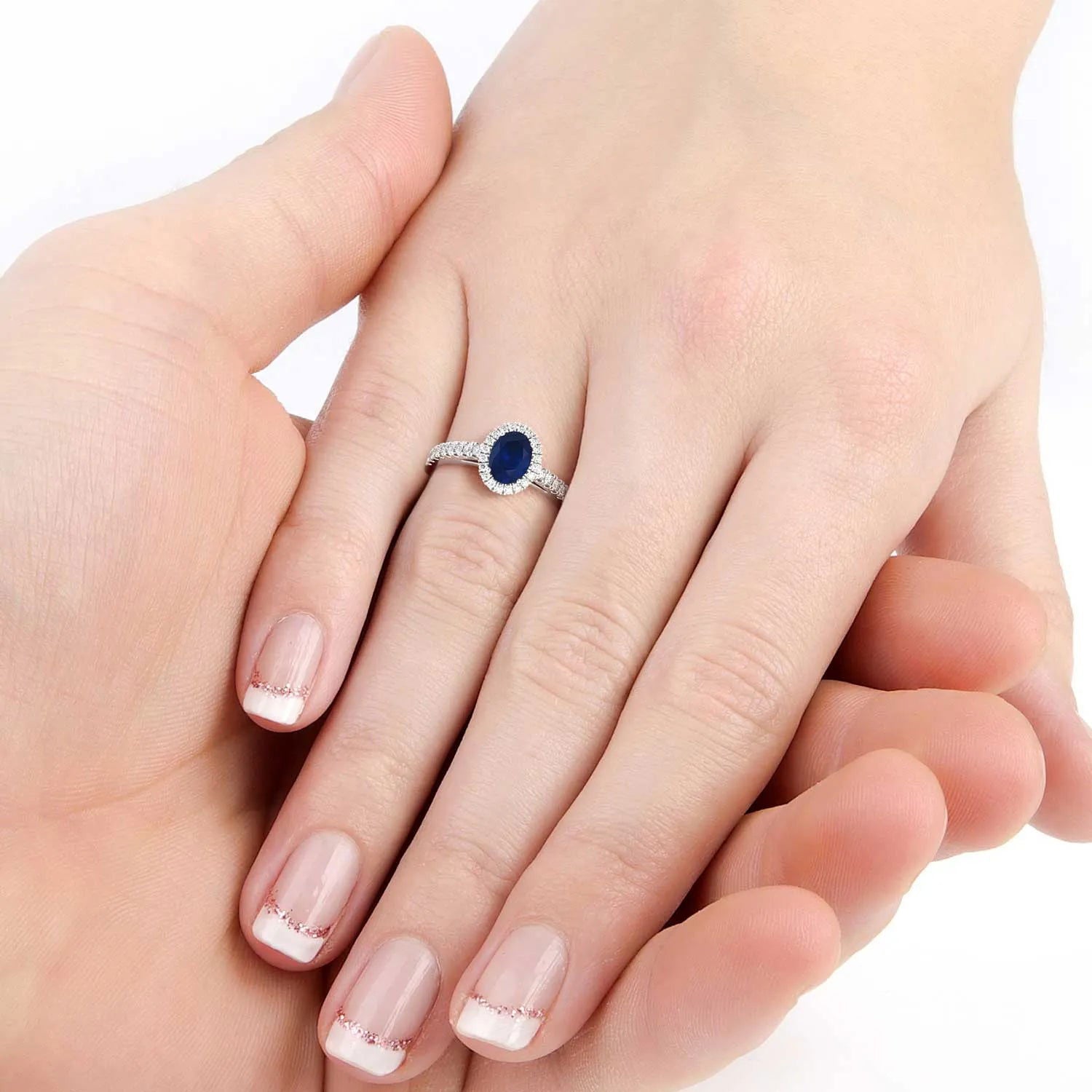 Oval-cut sapphire ring with halo design