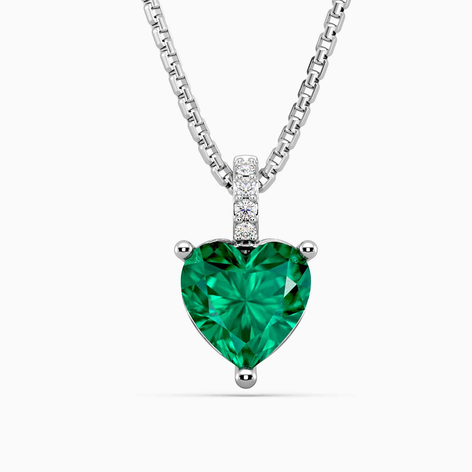 Sterling silver necklace featuring a heart-shaped emerald pendant with a pave-set bail.