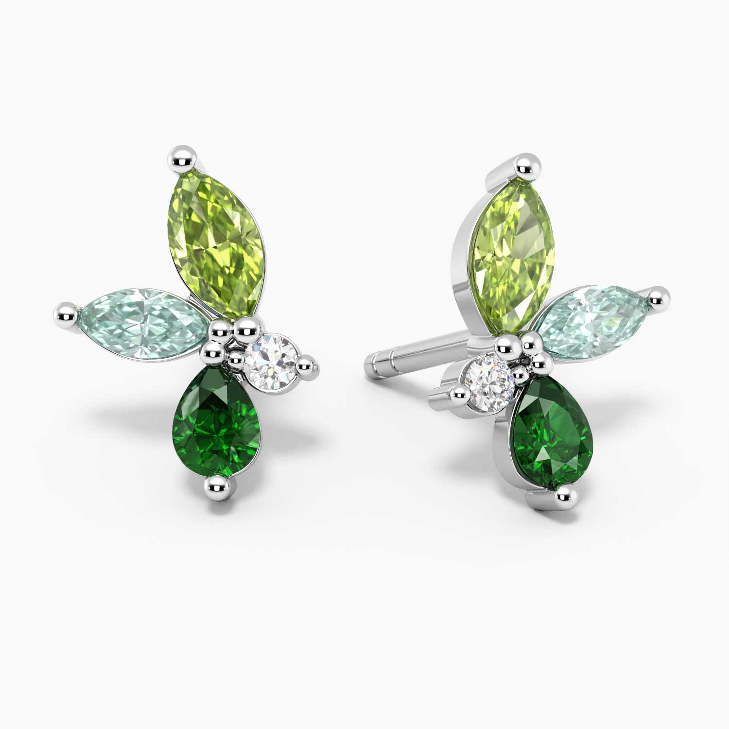 Green gemstone earrings featuring a stunning cluster of marquise, pear, and round cut stones in silver, perfect as green earrings for a stylish, elegant look.