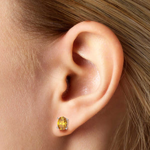 model featuring citrine crystal earrings