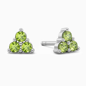 closeup image of trio peridot earrings in silver