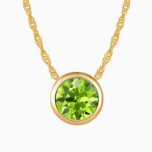 Bezel set round peridot necklace in 18K gold with a sparkling natural gemstone, perfect for August birthstone gifts.