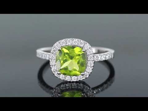 Video thumbnail of Cushion Cut Peridot Ring in Sterling Silver, featuring a vibrant peridot gemstone with a halo of diamond alternatives.