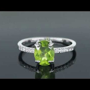 Video showcasing the Oval Peridot Silver Ring with Sparkling CZ Side Stones